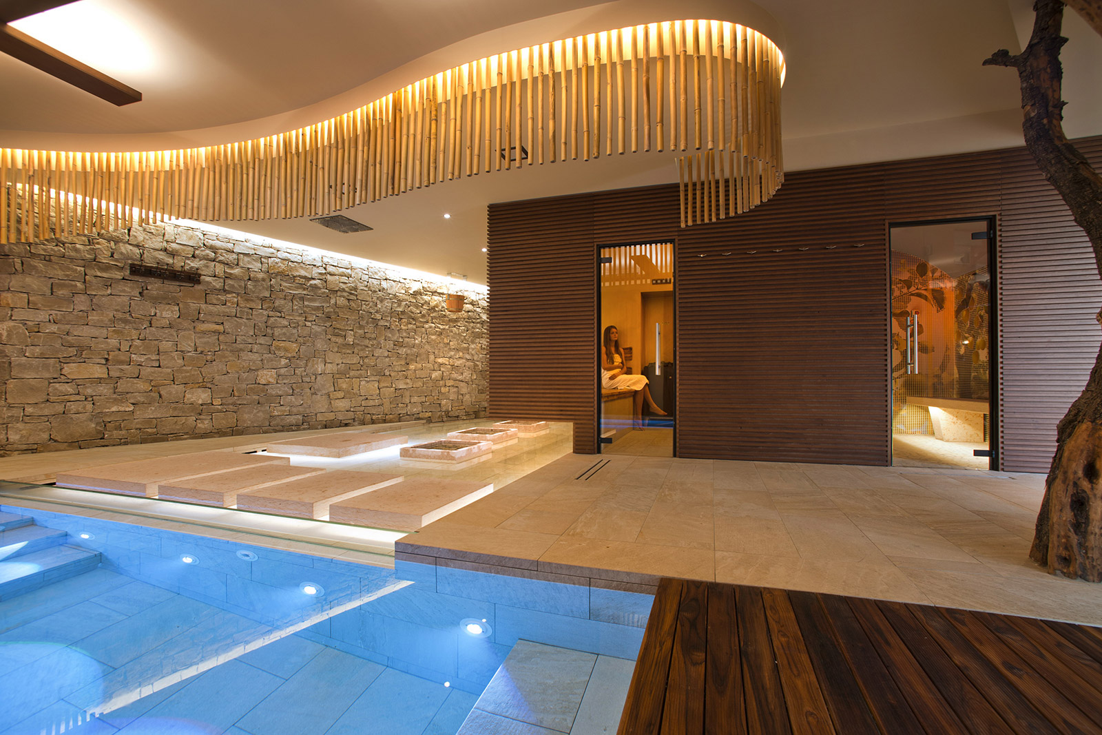 The Dhara spa with its stone wall and indoor pool